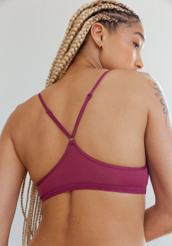 model is wearing an M bralette-pink the micro lace trim bralette