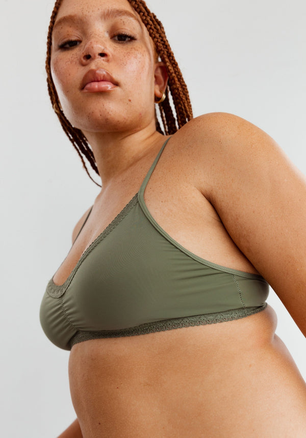 model is wearing an M bralette-green the micro lace trim bralette