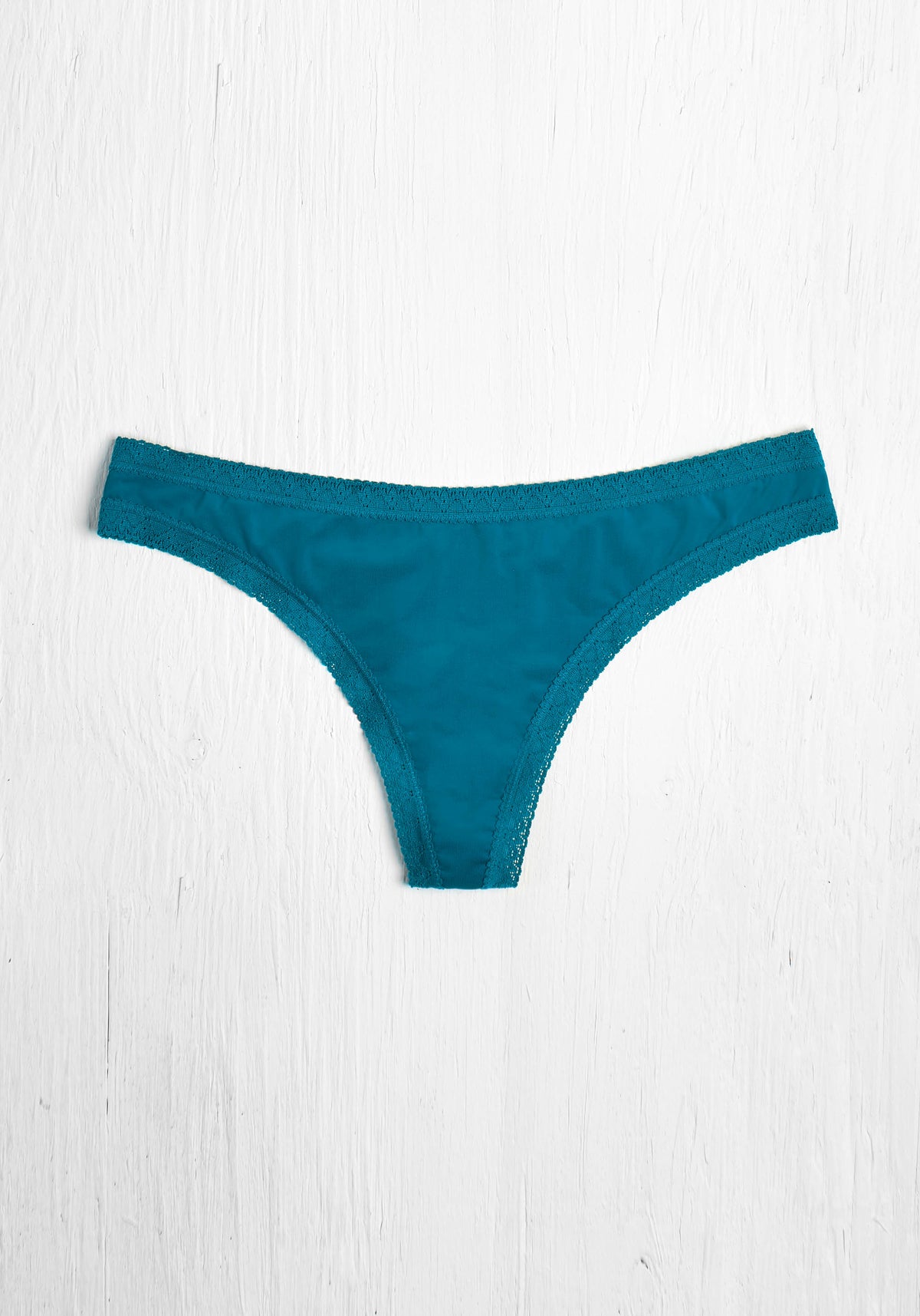 model is wearing an M panty - green the micro lace trim thong