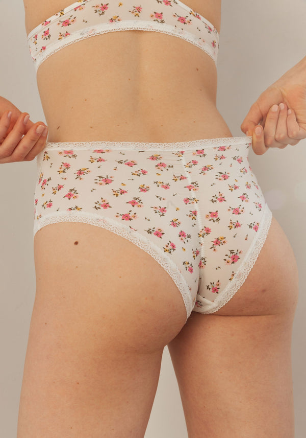 model is wearing an S panty-multi,white the micro lace trim hipster