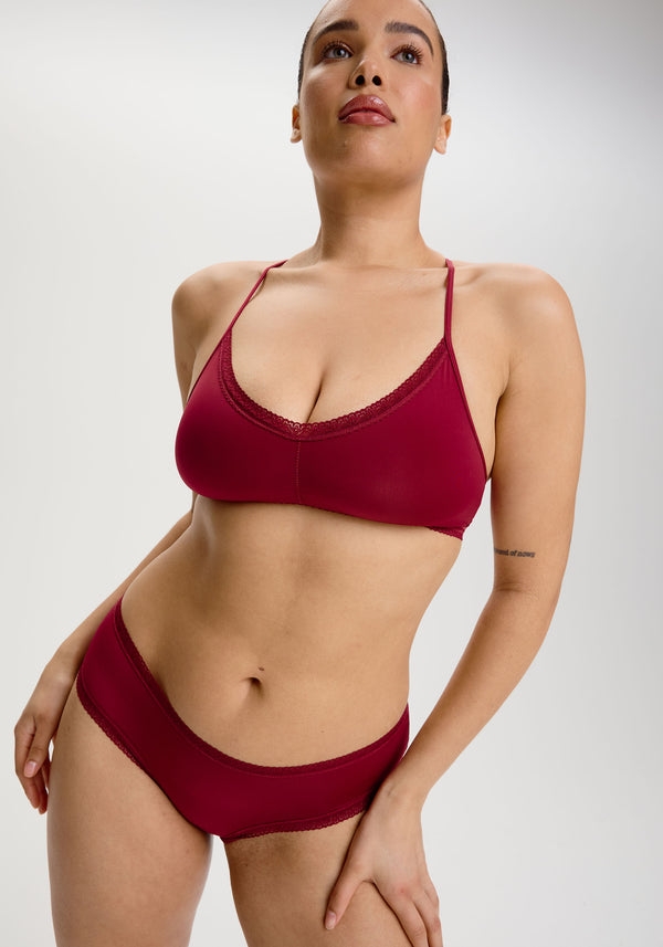 model is wearing an M panty - red the micro lace trim hipster