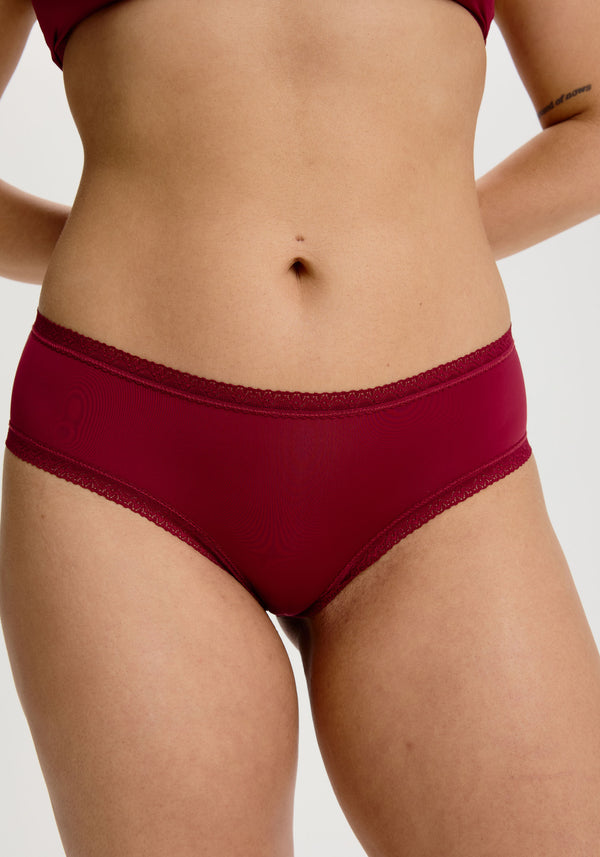 model is wearing an M panty - red the micro lace trim hipster