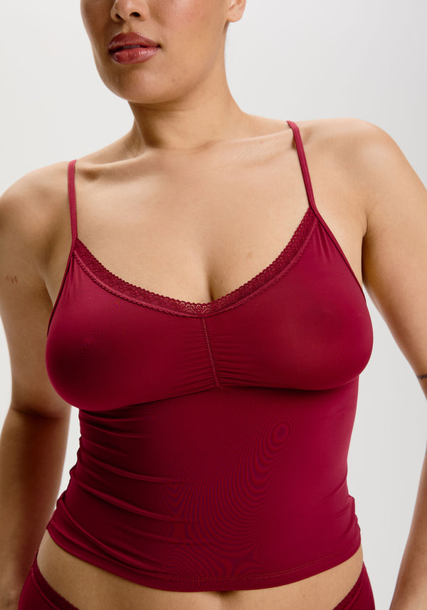 model is wearing an M cami - red the micro lace trim cami