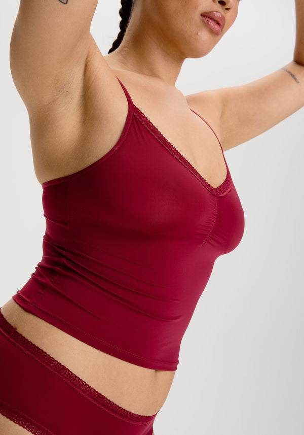 model is wearing an M cami - red the micro lace trim cami