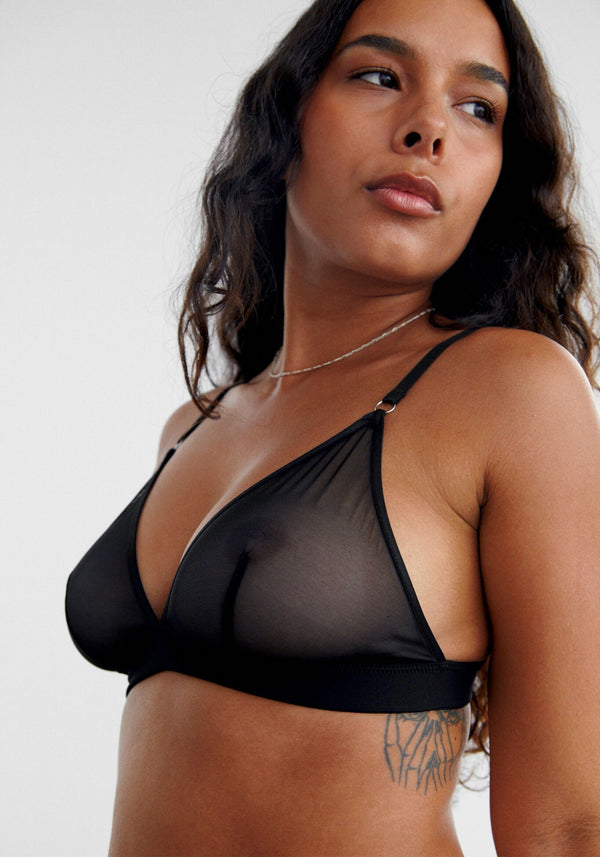 model is wearing an M bralette-black delirium bralette