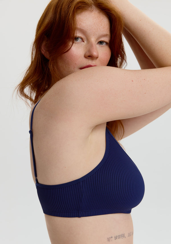 model is wearing an M bralette - blue the rib bralette