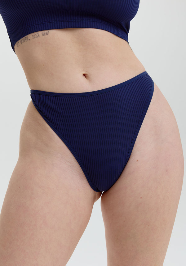 model is wearing an S panty - blue the rib high leg thong