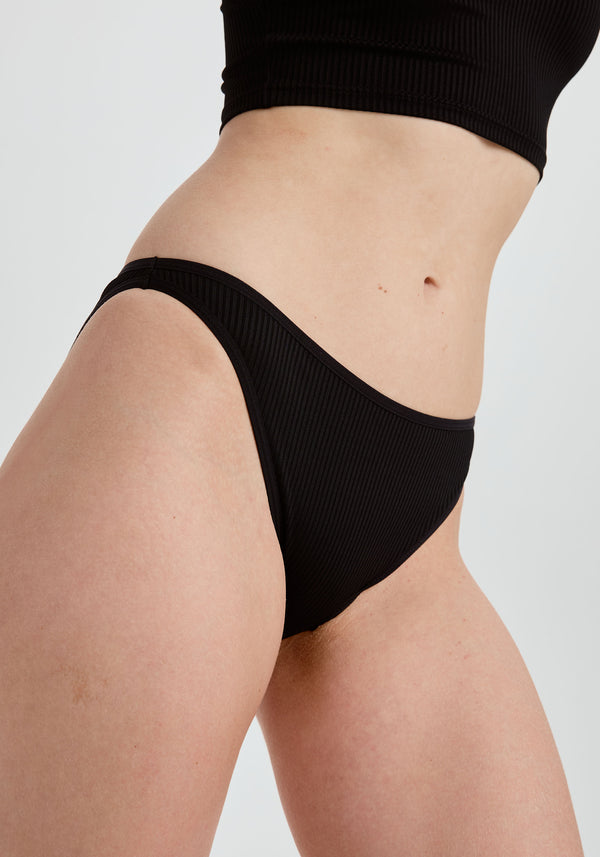 model is wearing an S panty - black the rib high leg bikini
