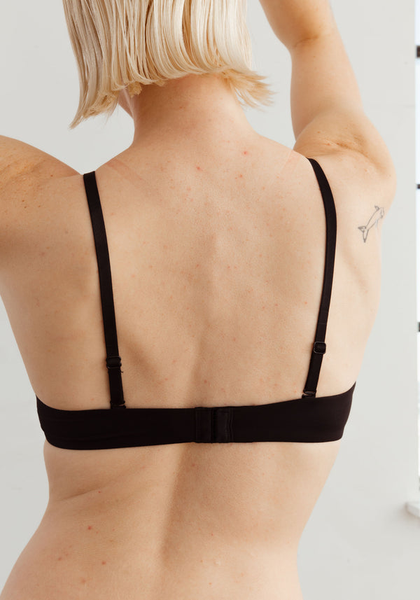 model is wearing a 36D bra-black the no-show lightly lined wireless bra