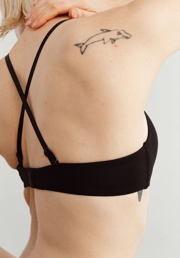 model is wearing a 36D bra-black the no-show lightly lined wireless bra