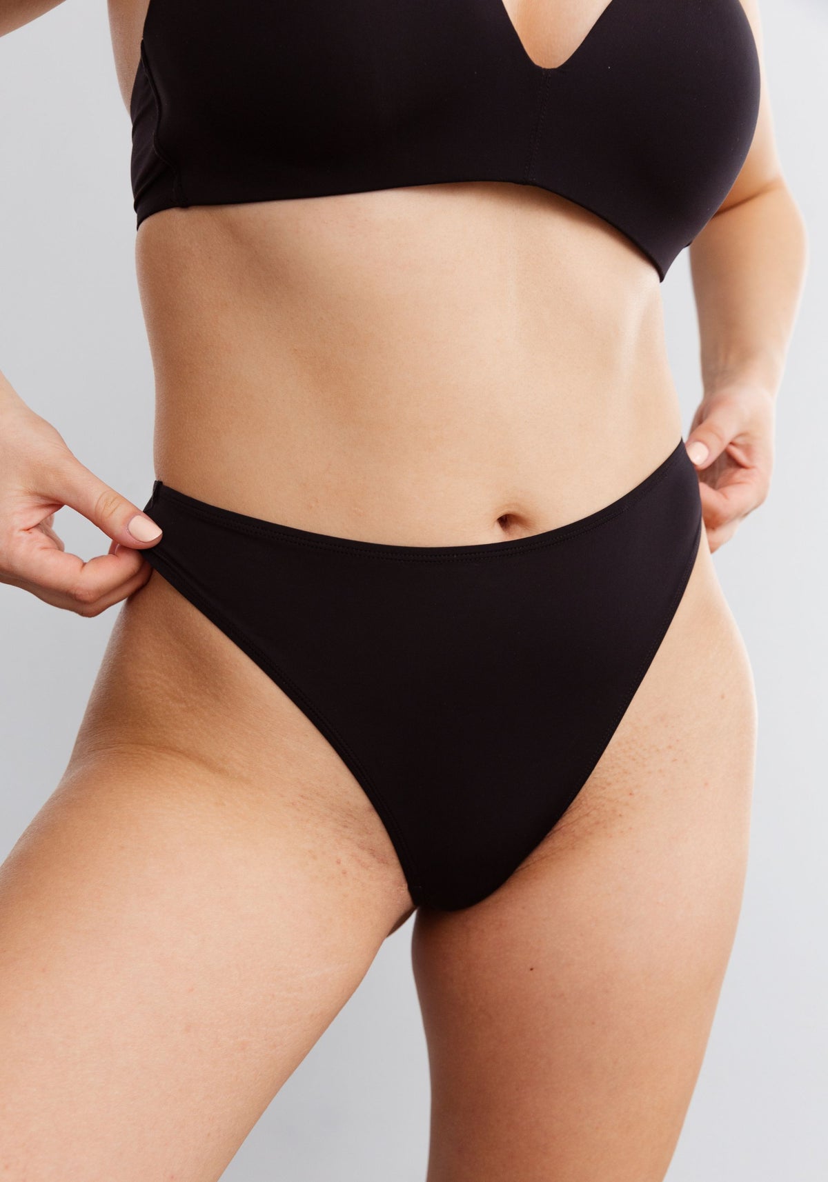 model is wearing an M panty-black the micro high leg thong