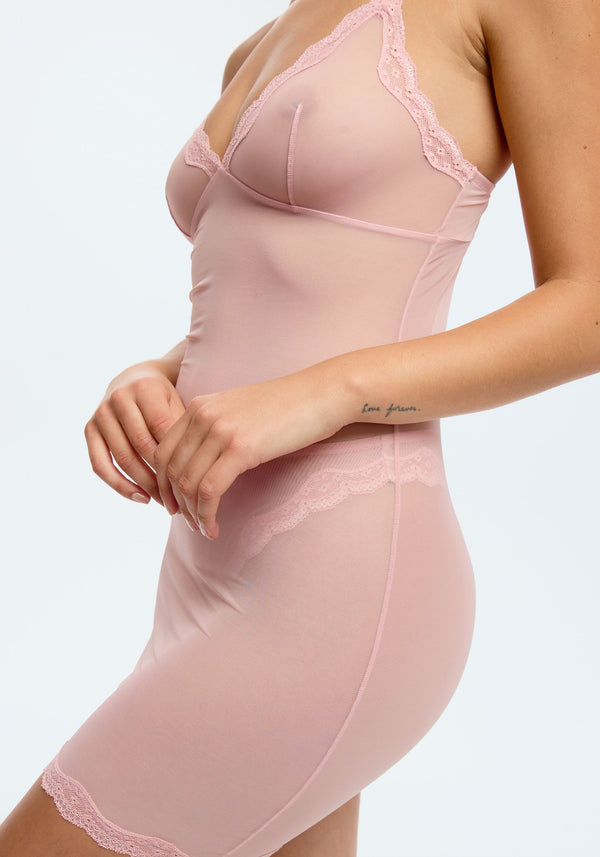 model is wearing an S slip-pink lotus slip