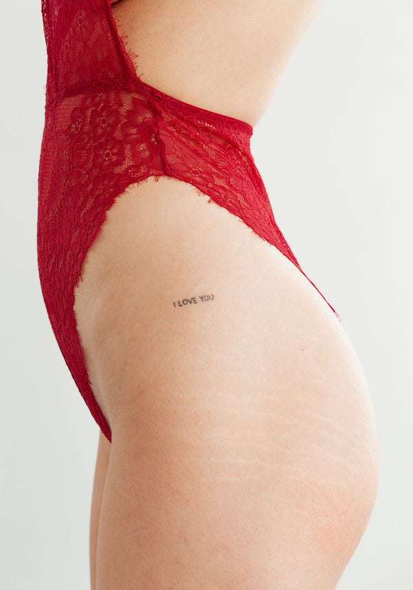 model is wearing an S bodysuit-red iris bodysuit