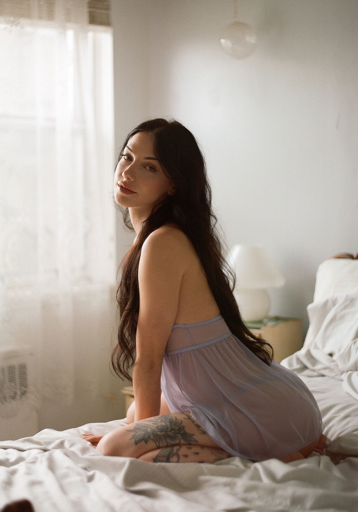 model is wearing an S slip-purple caché babydoll
