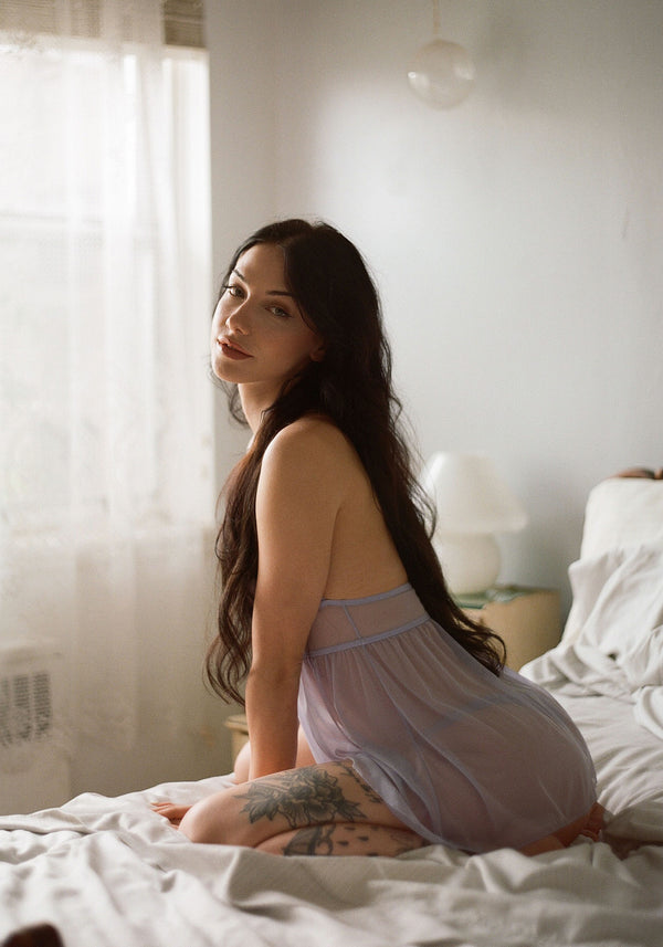 model is wearing an S slip-purple caché babydoll