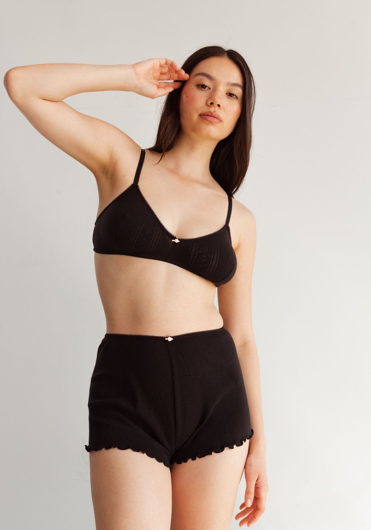 model is wearing an S short - black dream cotton pointelle short