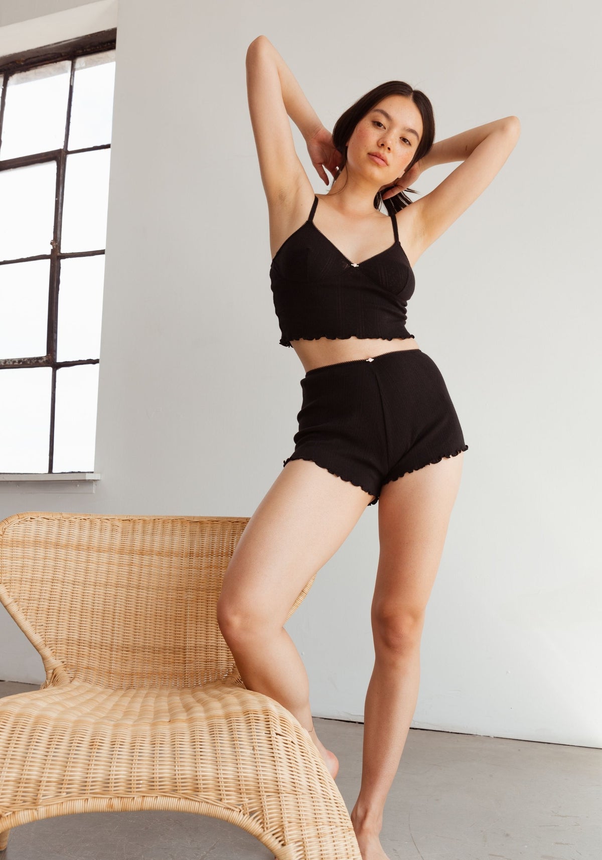 model is wearing an S short - black dream cotton pointelle short