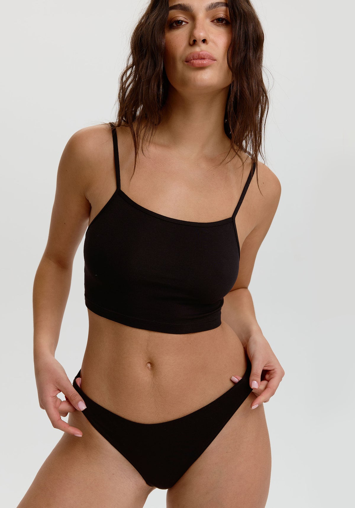 model is wearing an S panty-black the cotton low rise thong