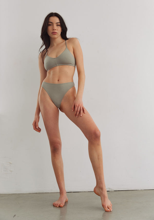 model is wearing an S panty-green the cotton high leg thong