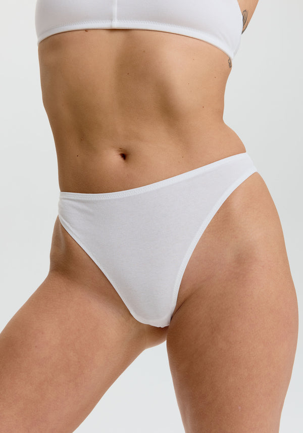 model is wearing an S panty-white the cotton high leg thong