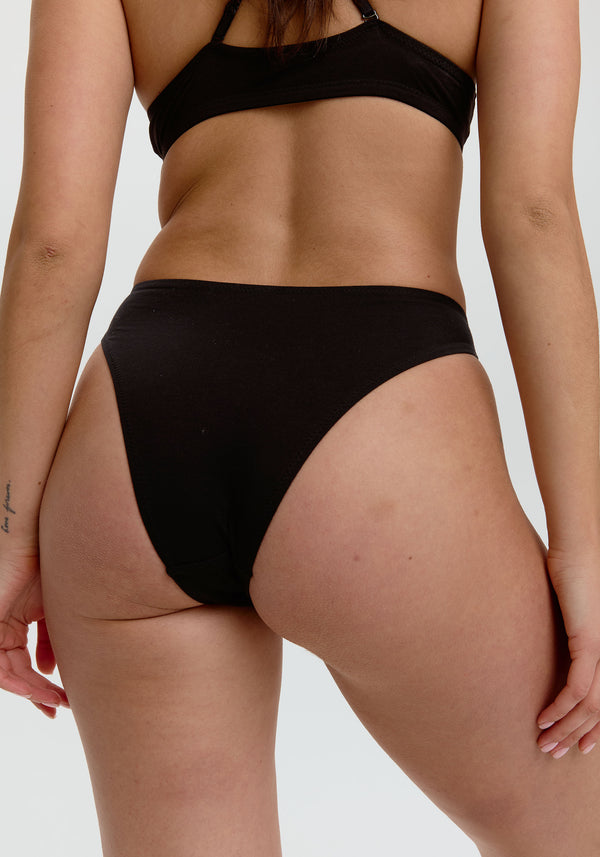 model is wearing an S panty-black the cotton high leg bikini