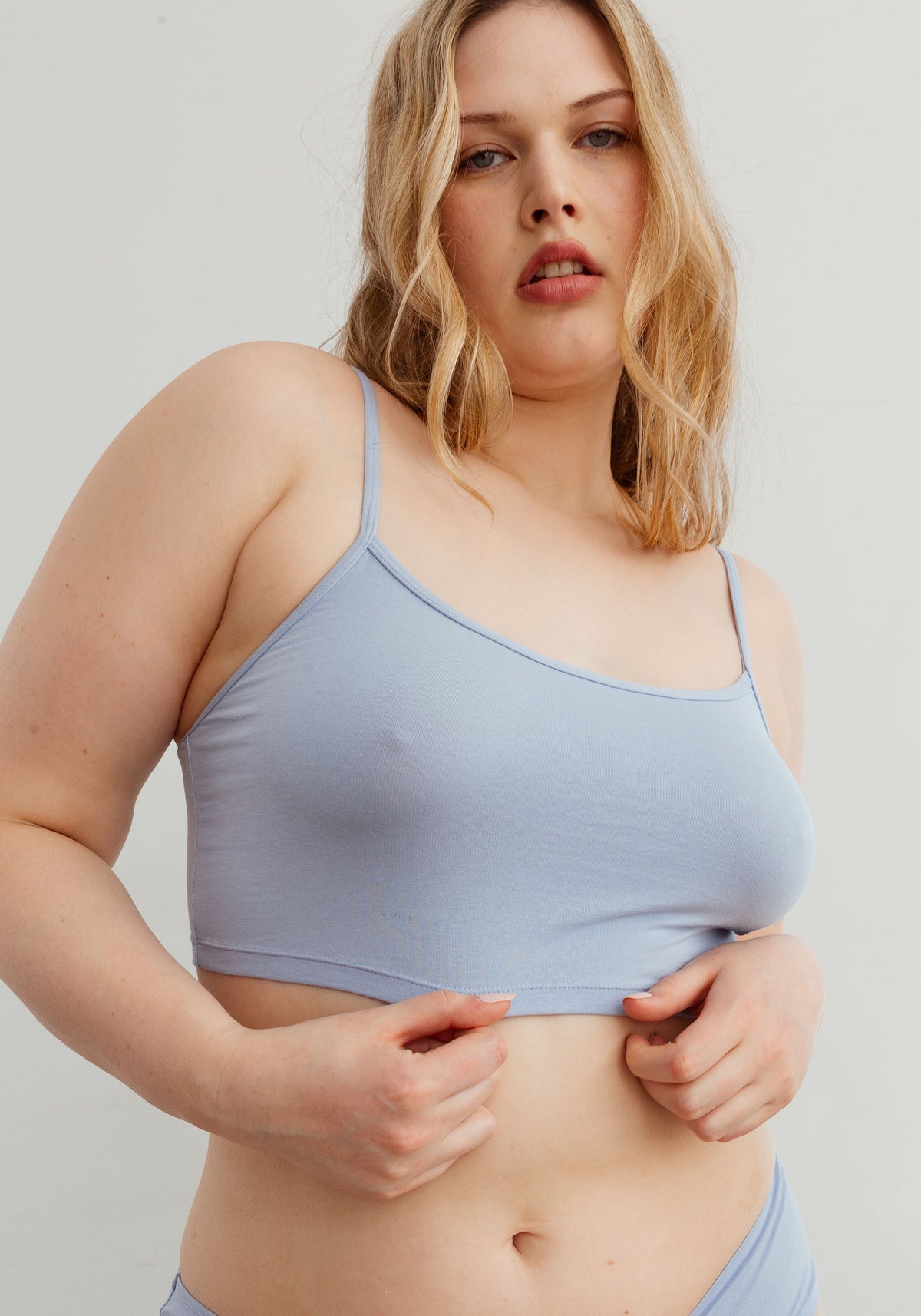 model is wearing an L cami-blue the cotton crop cami