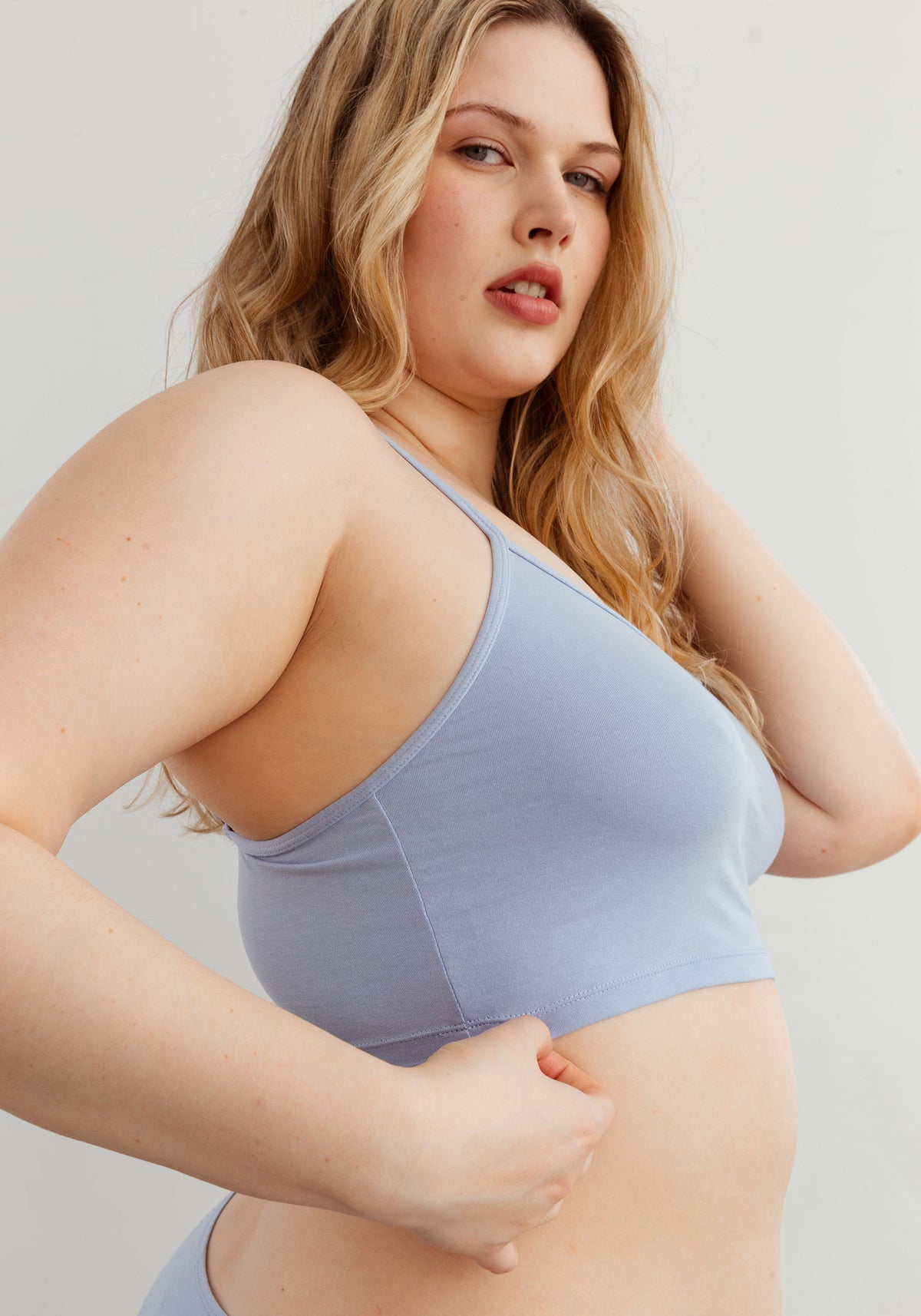 model is wearing an L cami-blue the cotton crop cami