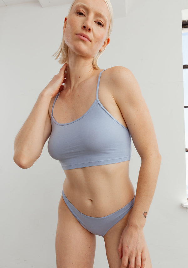 model is wearing an L cami-blue the cotton crop cami