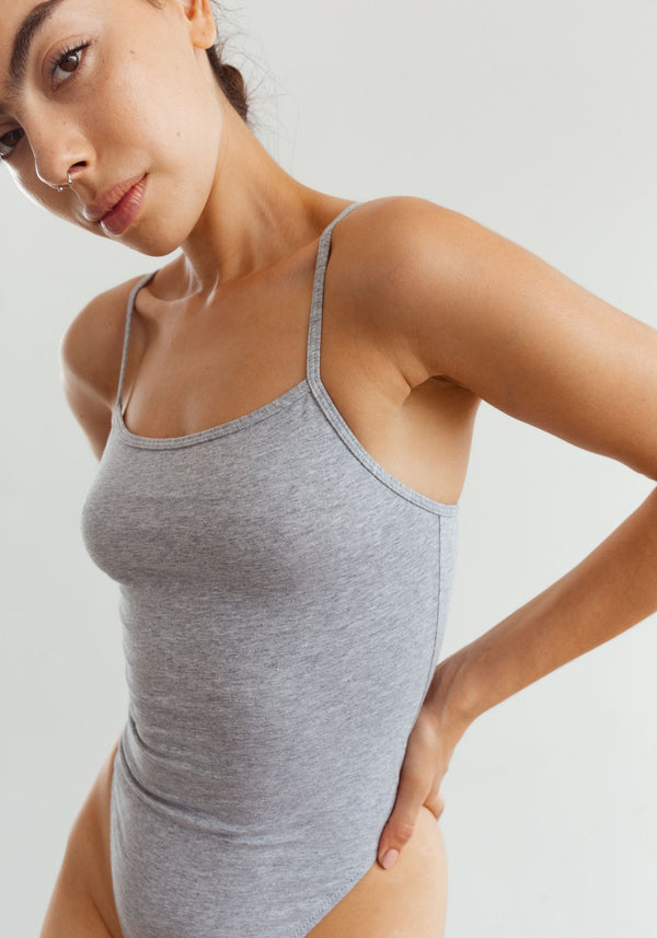model is wearing an XS bodysuit-grey the cotton bodysuit