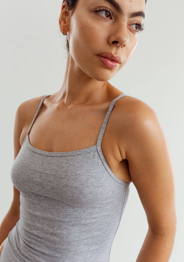 model is wearing an XS bodysuit-grey the cotton bodysuit