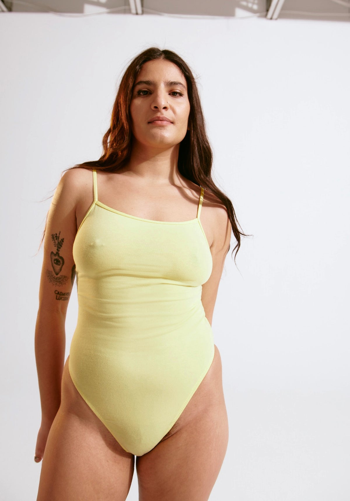 model is wearing an S bodysuit-yellow the cotton bodysuit