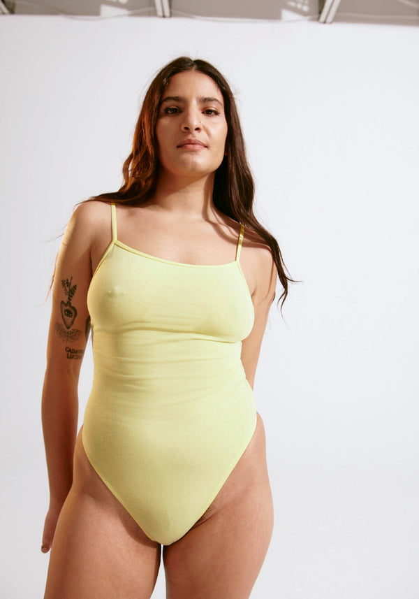 model is wearing an S bodysuit-yellow the cotton bodysuit