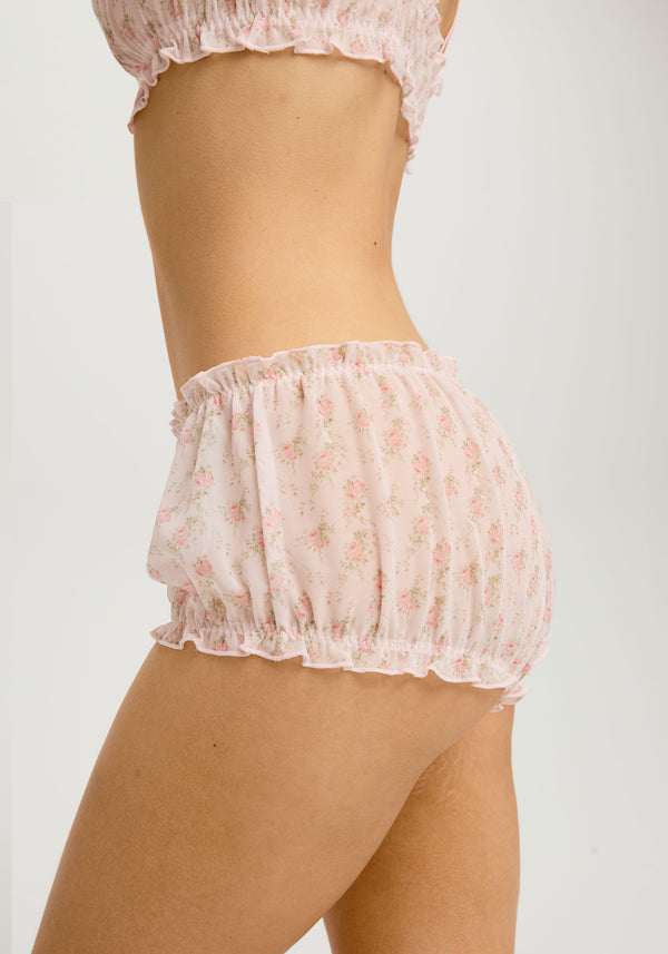 model is wearing an XS bloomer - multi,pink willow bloomer