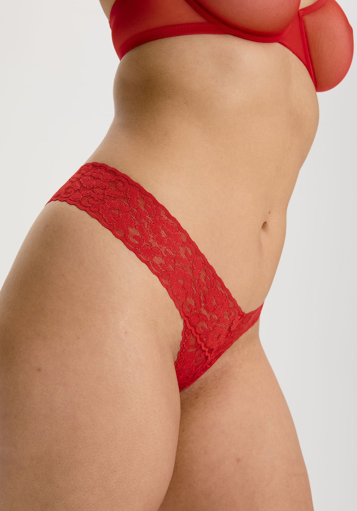 model is wearing an M panty - red the lace band thong