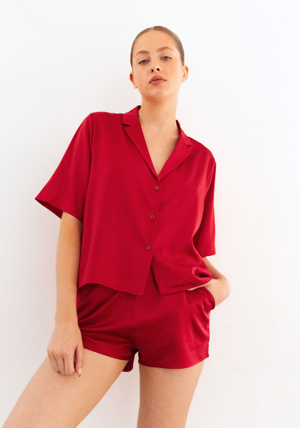 model is wearing an S top-red after hours satin top