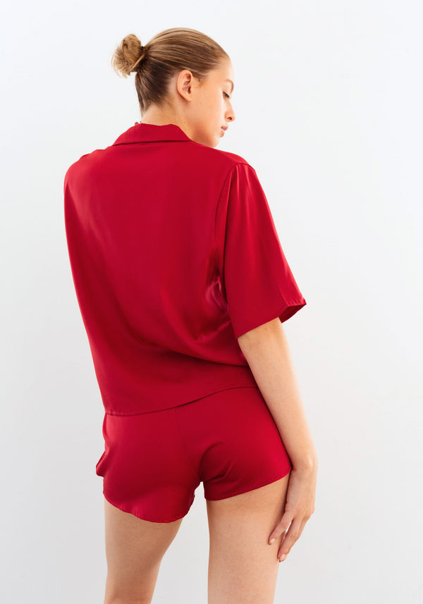 model is wearing an S top-red after hours satin top