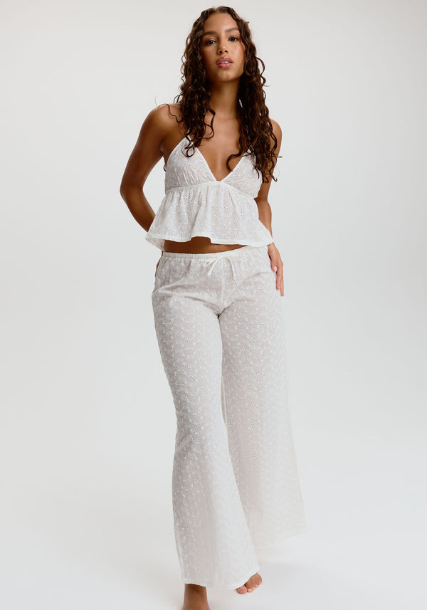 model is wearing an S pant - white wander embroidered eyelet pant