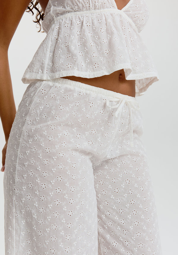 model is wearing an S pant - white wander embroidered eyelet pant