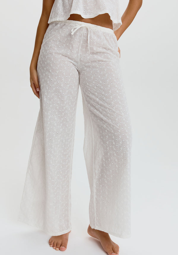 model is wearing an S pant - white wander embroidered eyelet pant