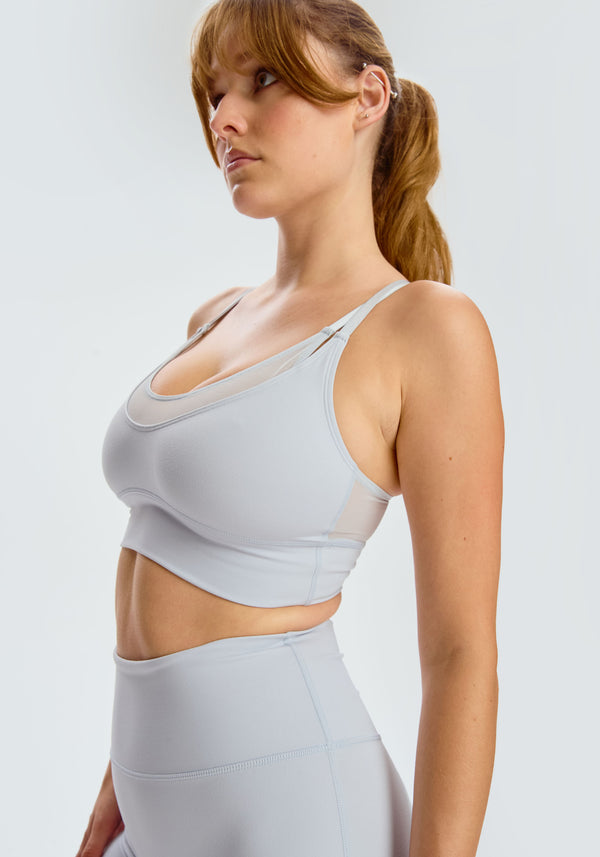 model is wearing an M sports bra-blue,grey pulse sports bra