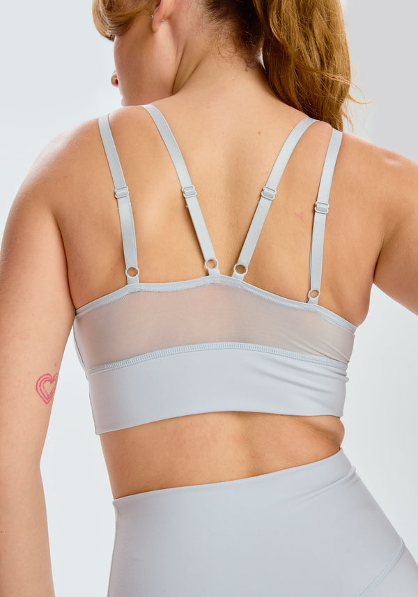 model is wearing an M sports bra-blue,grey pulse sports bra