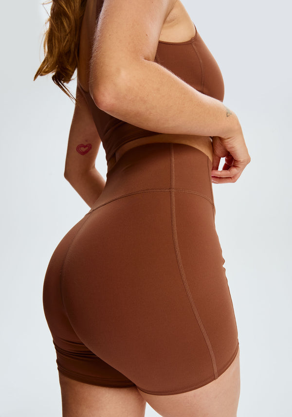 model is wearing an S short-brown core short