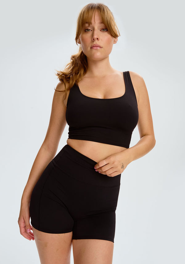 model is wearing an S tank-black core crop tank