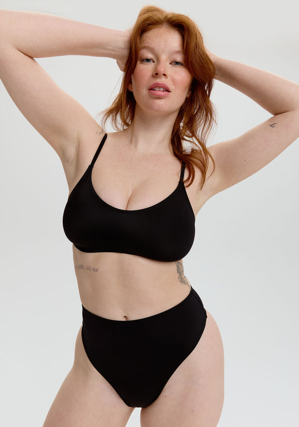 model is wearing an S bikini bottom - black belize high waist thong bikini bottom