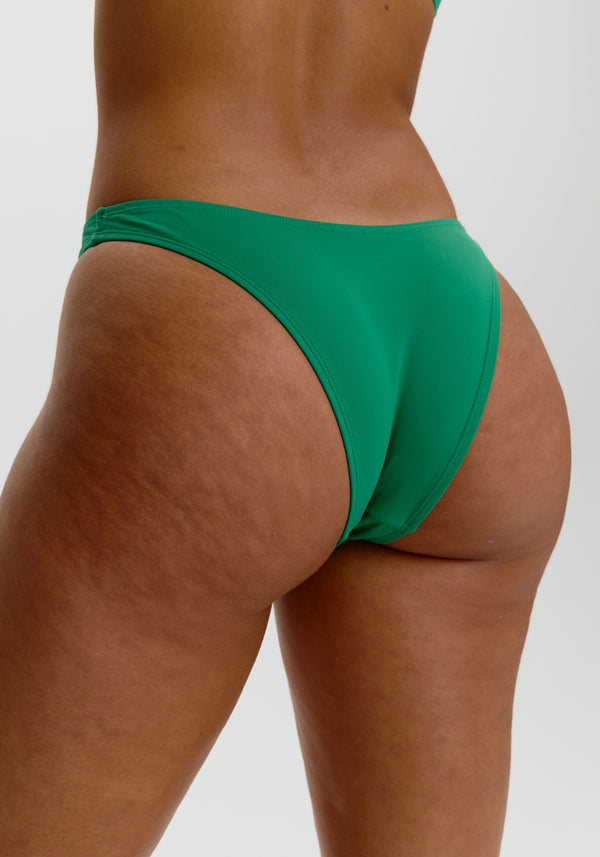 model is wearing an S bikini bottom - green capri high leg bikini bottom