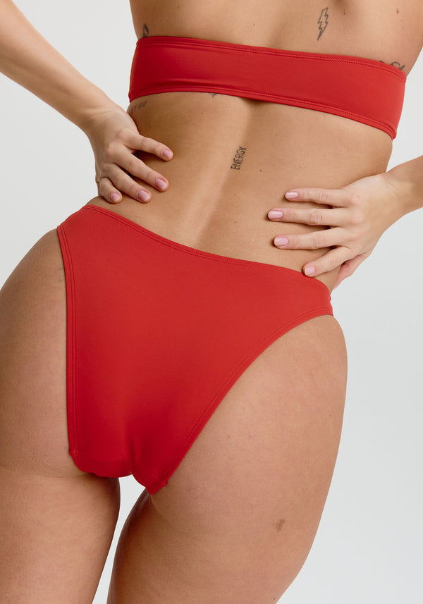 model is wearing an S bikini bottom - red capri high leg bikini bottom