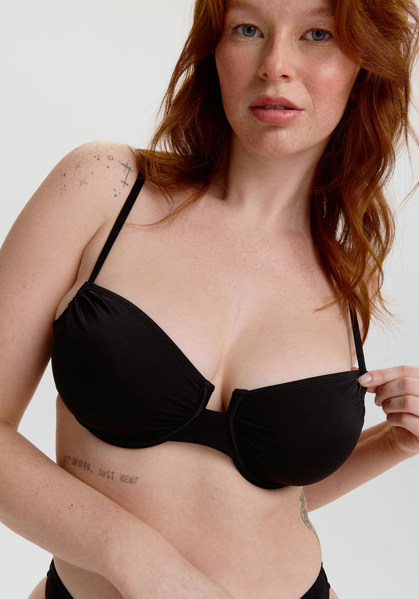 model is wearing an S+ bikini top - black malta underwire bikini top
