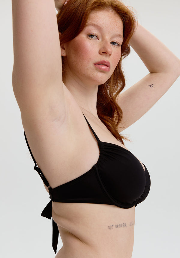 model is wearing an S+ bikini top - black malta underwire bikini top