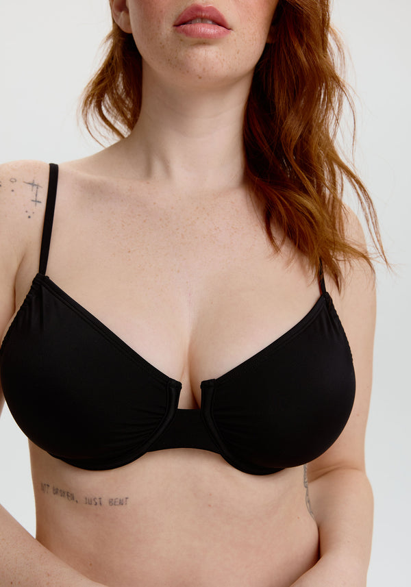 model is wearing an S+ bikini top - black malta underwire bikini top