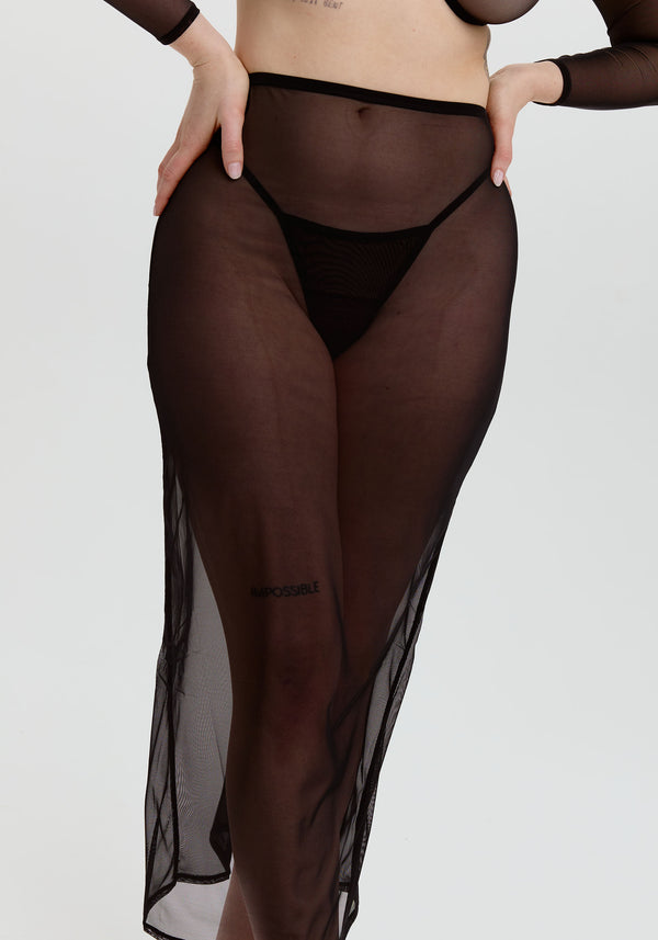 model is wearing an S skirt-black gaia midi skirt